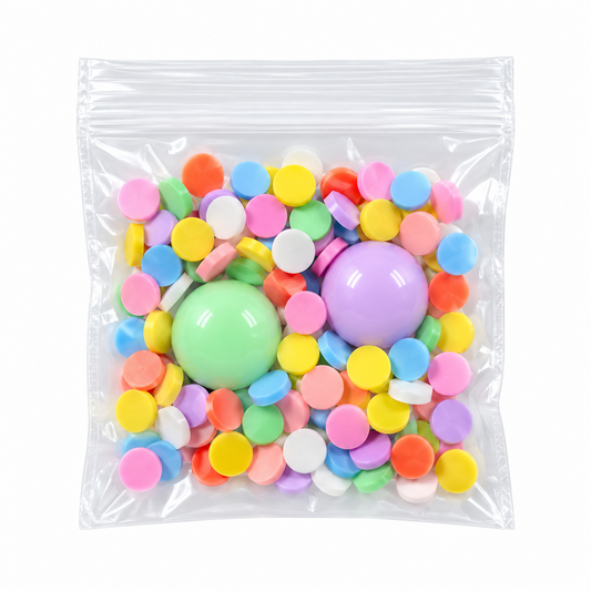 Clear packet of colorful sprinkles with two pastel gumball beads
