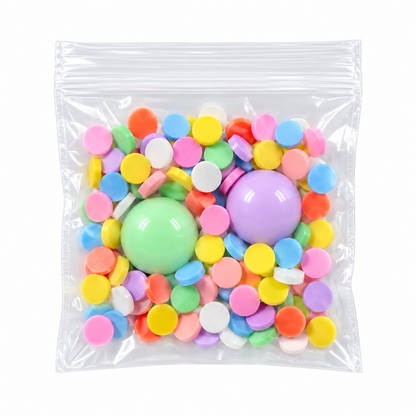 Clear packet of colorful sprinkles with two pastel gumball beads