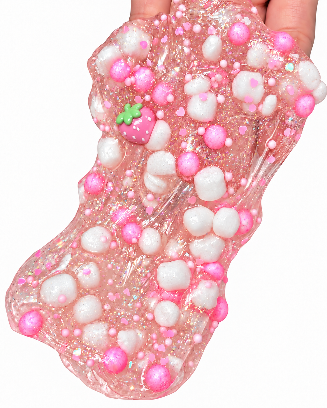 Strawberry Sparkling Soda slime stretched in a hand with pink and white foam beads