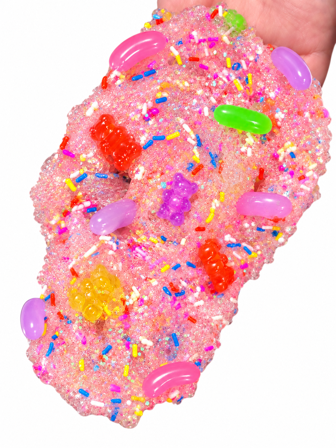 Sugar Rush crunchy clear slime held in a hand with beads, sprinkles and faux candy charms